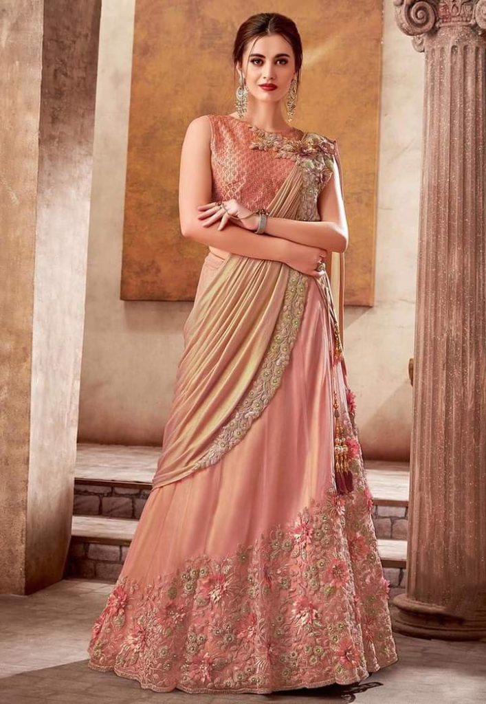 Women's designer lehenga saree in pink, featuring elegant ethnic wear and traditional Indian fashion style